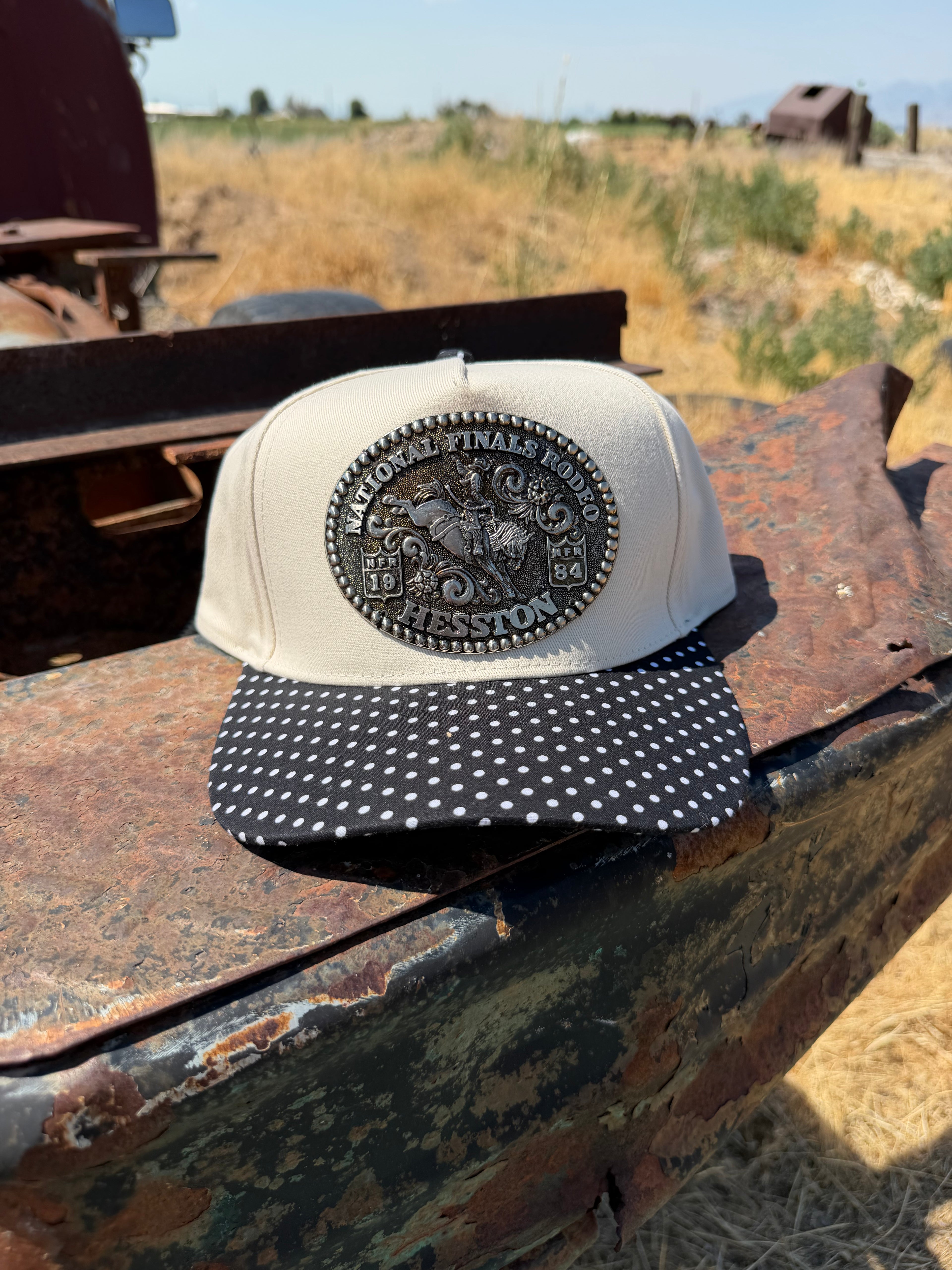 1984 Hesston NFR Buckle on a black polka dot hat