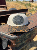 1984 Hesston NFR Buckle on a leopard hat